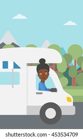 An african-american woman driving a motor home in the forest. Woman travelling by camper van. Vector flat design illustration. Vertical layout.