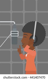 An african-american woman in headphones making a record of her voice in studio vector flat design illustration. Vertical layout.