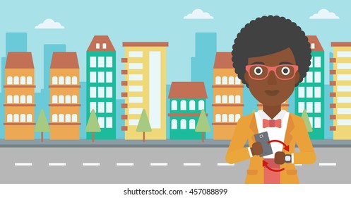 An african-american woman holding a smartphone looking at her smart watch. Synchronization between smartwatch and smartphone. Vector flat design illustration. Horizontal layout.