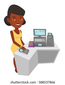 African-american woman paying wireless with her smart watch at the checkout counter. Customer making payment for purchase with smart watch. Vector flat design illustration isolated on white background