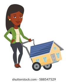 African-american woman pushing a shopping trolley with a house. Young woman buying home. Woman using shopping trolley to transport a house. Vector flat design illustration isolated on white background
