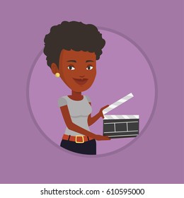 African-american woman working with a clapperboard. Woman holding an open clapperboard. Woman holding blank movie clapperboard. Vector flat design illustration in the circle isolated on background.