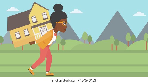 An african-american young woman carrying a big house on her back on the background of mountains. Vector flat design illustration. Horizontal layout.