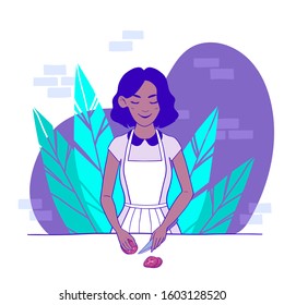 Afro American girl cooking food. Cute woman with an apron cutting vegetables. Adorable housewife preparing a meal at home in her pastime. Female cartoon character. Flat vector illustration.