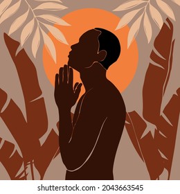 Afro American man stands in the jungle. The arms are folded over the chest. african black man profile portrait. Night or morning landscape with sun or moon background with banana leaves and palm tree