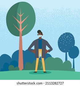 afro boy wearing facemask in landscape