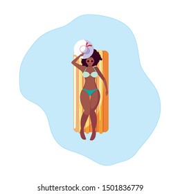 afro woman with float mattress floating in water