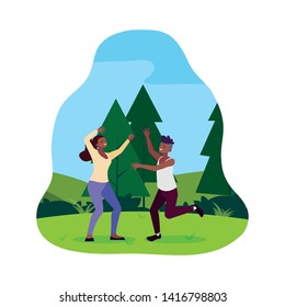 afro young couple celebrating in the park