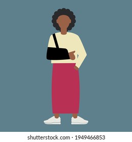Afro-American female wears a sling to support and immobilise her broken (fractured) or dislocated arm or shoulder