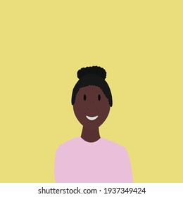 Afro-descendant young woman smiles on yellow background