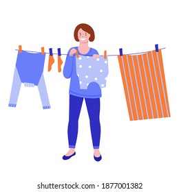 After washing, a young woman hangs the laundry on a rope to dry. Vector illustration. Flat style. Isolated on a white background.