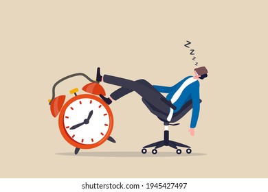 Afternoon slump, laziness and procrastination postpone work to do later, boredom and sleepy work concept, businessman sleeping lay down on office chair and alarm clock covered his face with book.