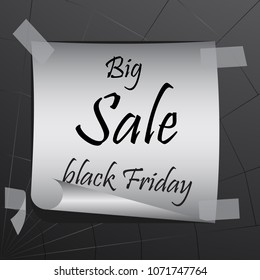 Against the backdrop of a cobweb, an ad made of paper with an inscription "Big sale black Friday" is taped.