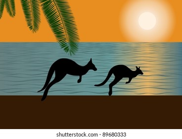 Against the backdrop of the ocean and setting sun on the bank of two galloping kangaroos