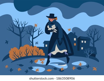 Against the background of an autumn landscape, gloomy park, a woman in a black coat and hat with a white dog steps over puddles.