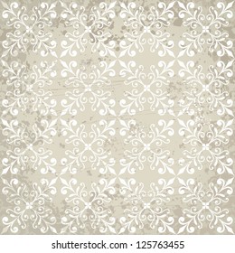 Aged vintage background with floral ornament elements.