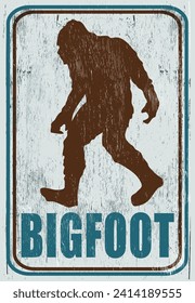 Aged and worn bigfoot sign on wood texture