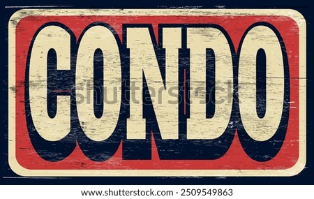Aged and worn condo sign on wood