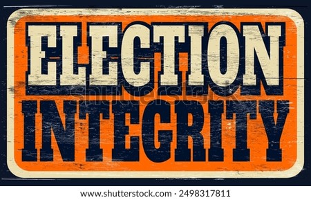 Aged and worn election integrity sign on wood