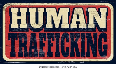Aged and worn human trafficking sign on wood