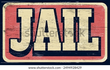Aged and worn jail sign on wood