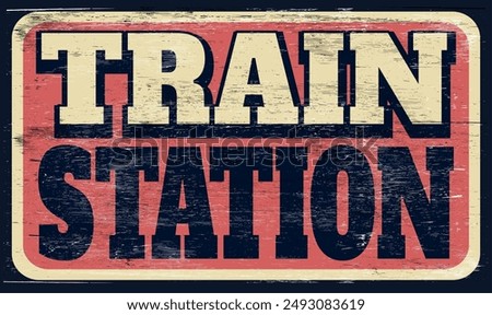 Aged and worn train station sign on wood