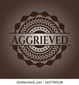 Aggrieved badge with wood background