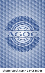 Agog blue badge with geometric pattern.