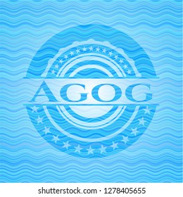 Agog light blue water wave emblem.