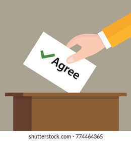 agree check mark choice vote hand putting a ballot paper in a slot of box