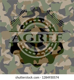 Agree written on a camouflage texture