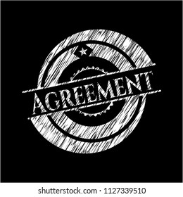 Agreement chalkboard emblem written on a blackboard