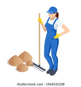 Agricultural work. Woman working in garden with rake leveling ground. Soil preparation for seeding and planting, garden tools, gardening, rake, soil, outdoor work concept.