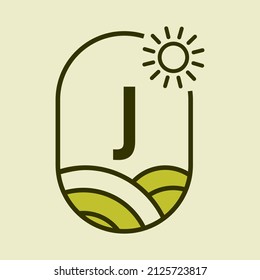 Agriculture Logo On Letter J Emblem Template. Farmland Letter J Agro Farm, Agribusiness, Eco-farm Sign with Sun and Agricultural Field Symbol