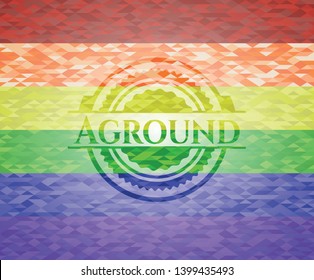 Aground emblem on mosaic background with the colors of the LGBT flag
