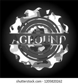Aground on grey camouflaged texture