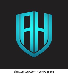 Monograma del logotipo AH con diseño de escudo de emblemas aislado con colores azules sobre fondo negro