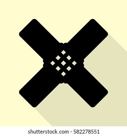 Aid sticker sign. Black icon with flat style shadow path on cream background.