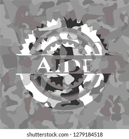 Aide on grey camouflaged pattern