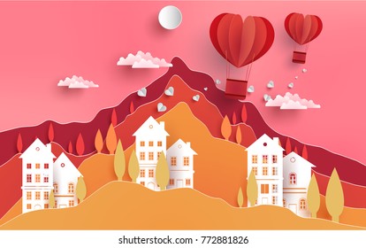 air balloon flying over mountains and housing. the symbol of love in the form of a air balloon. There are houses and a pink background. paper art design