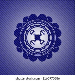 air drone icon inside badge with denim background
