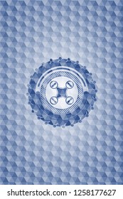 air drone icon inside blue emblem or badge with geometric pattern background.