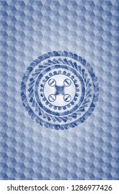 air drone icon inside blue badge with geometric background.