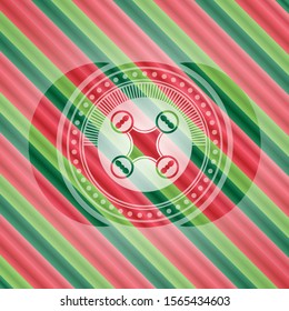 air drone icon inside christmas colors style badge.