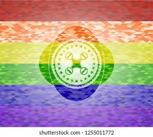 air drone icon inside emblem on mosaic background with the colors of the LGBT flag