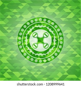 air drone icon inside green emblem with mosaic ecological style background