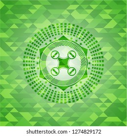 air drone icon inside green emblem with mosaic ecological style background