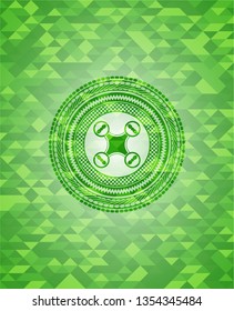 air drone icon inside green mosaic emblem