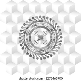 air drone icon inside grey badge with geometric cube white background