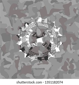 air drone icon inside grey camouflage emblem